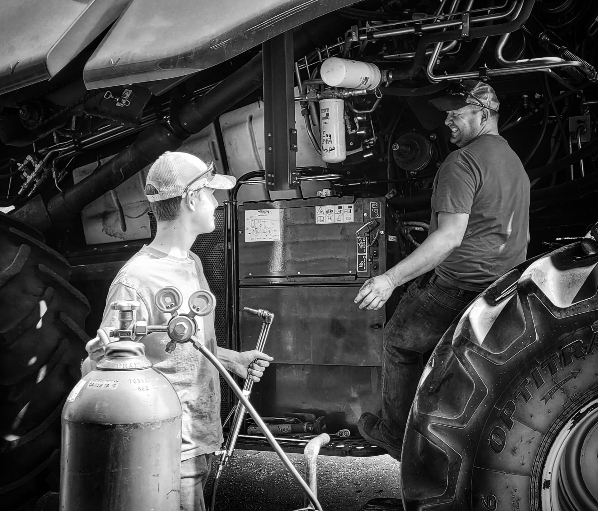Father and son repairing the machine